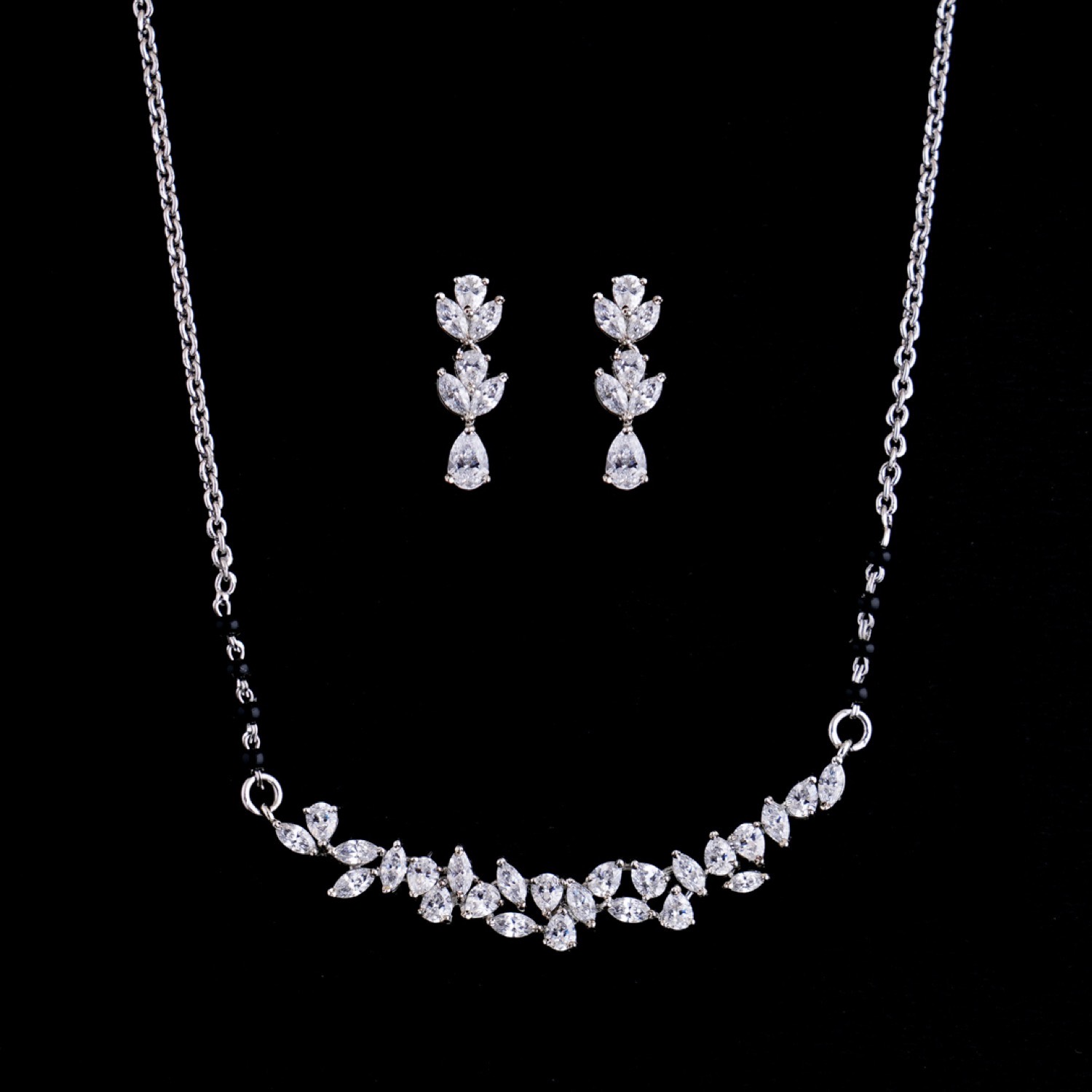 varam_swarovski_white_stone_leaf_design_silver_chain_with_earrings_1-1