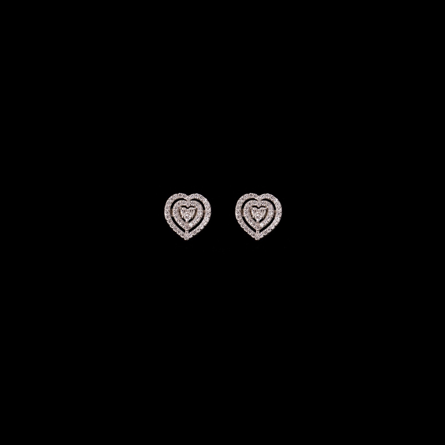 varam_earrings_102022_heart_shaped_hollow_design_studded_silver_earrings-1